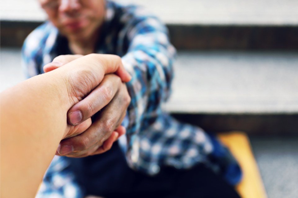 2 persons shaking hands with each other